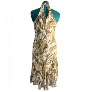 “Chic halter neck dress with a stunning abstract pattern in earthy tones.